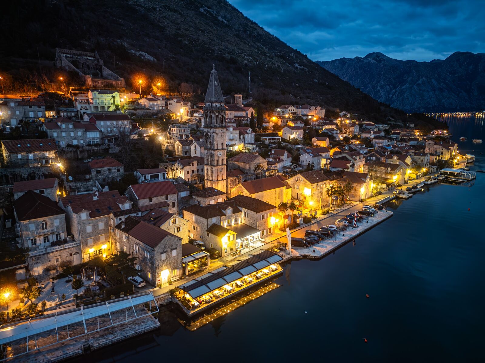Perast by night — waterfront and bell tower
